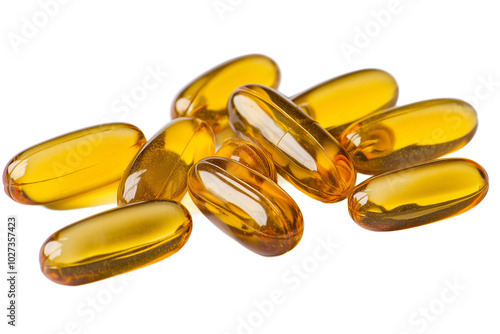 Various yellow health supplement capsules scattered on a white surface, showcasing their vibrant color and transparent design