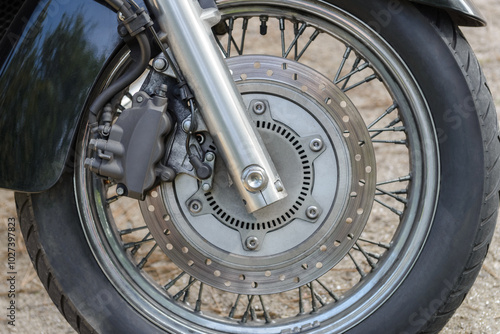 front brake disc of black custom motorcycle close up