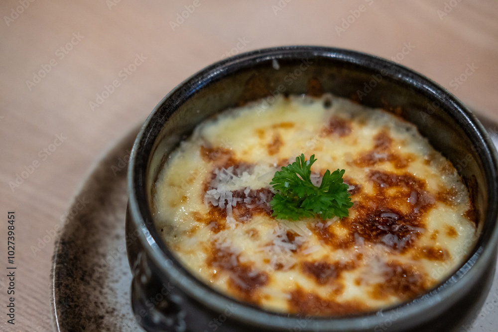 Mashed potato with cheese on top, serve in a bowl Mashed potato with cheese on top, serve in a bowl