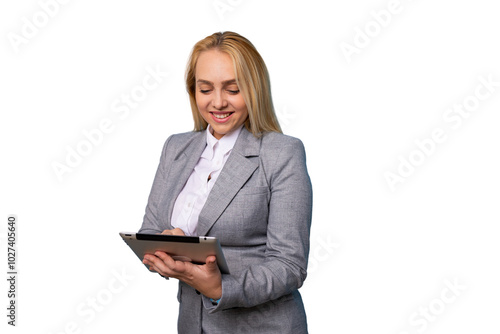 Young businesswoman in corporate attire holding a tablet