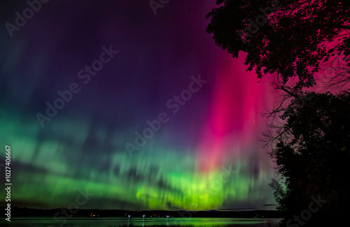 Northern Lights (Aurora Borealis) lights up the sky on a beautiful cold autumn night along the Ottawa river near Ottawa, Canada Oct 10, 2024