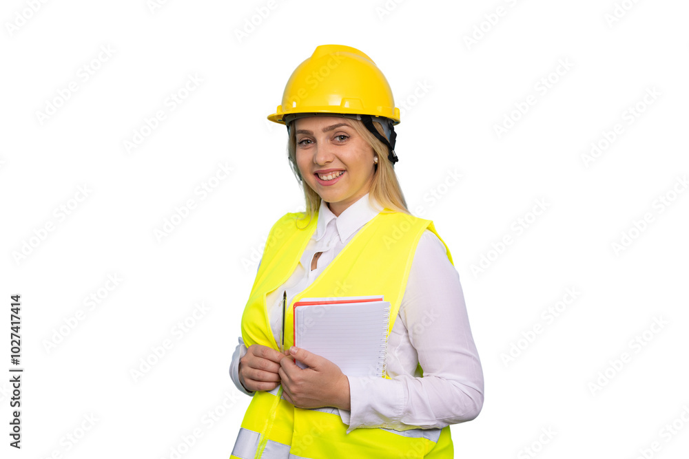 Energetic young woman engineer in a hard hat on-site