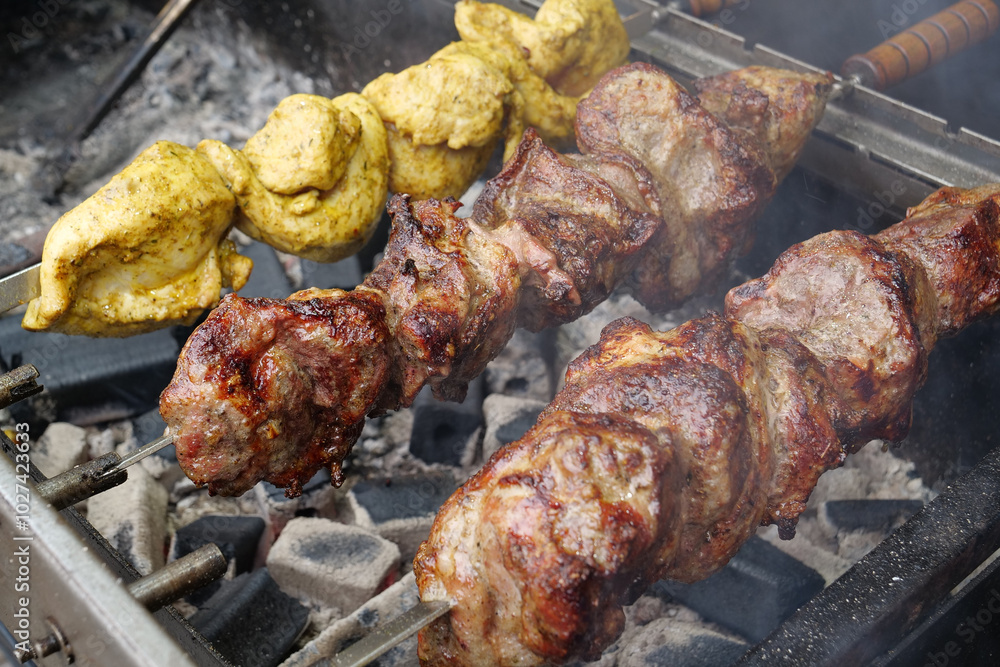 Shish kebabs broils in barbecue. Delicious hot kebabs. Meat are cooked Shish kebabs broils in barbecue. Delicious hot kebabs. Meat are cooked