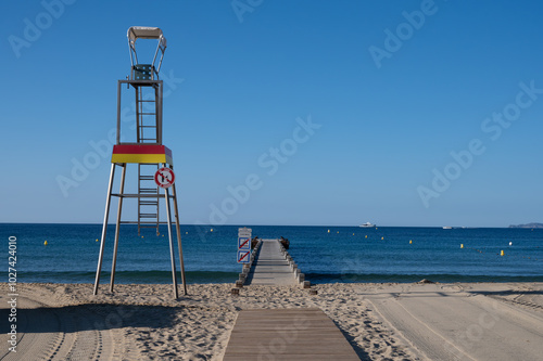 Morning view on crystal clear blue water of Plage du Debarquement white sandy beach near Cavalaire-sur-Mer and La Croix-Valmer, summer vacation on French Riviera, Var, France