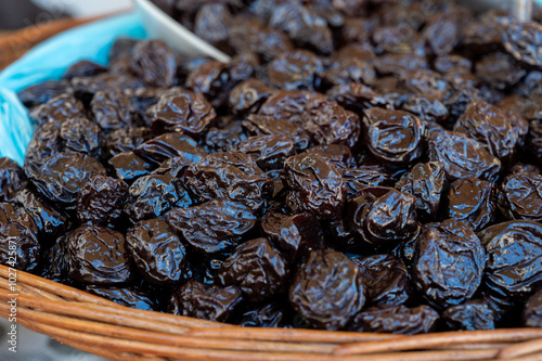 Bulk dried dehydrated black plums from Agen, France on local market in Biarritz