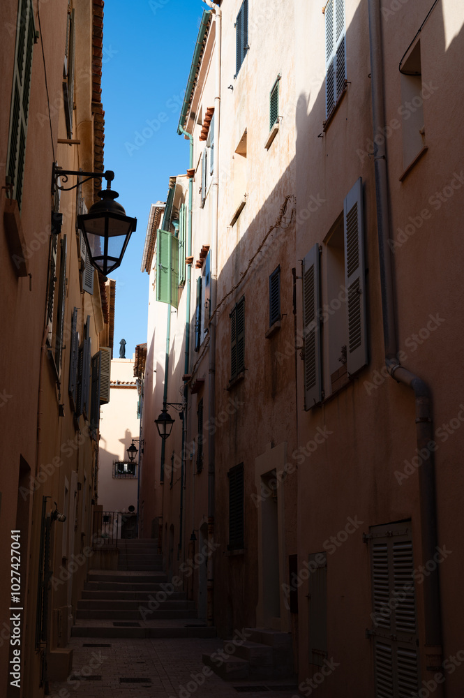 Walking in Saint-Tropez famous touristic village on French Riviera, summer vacation, colorful houses, Var, Provence, France Walking in Saint-Tropez famous touristic village on French Riviera, summer vacation, colorful houses, Var, Provence, France