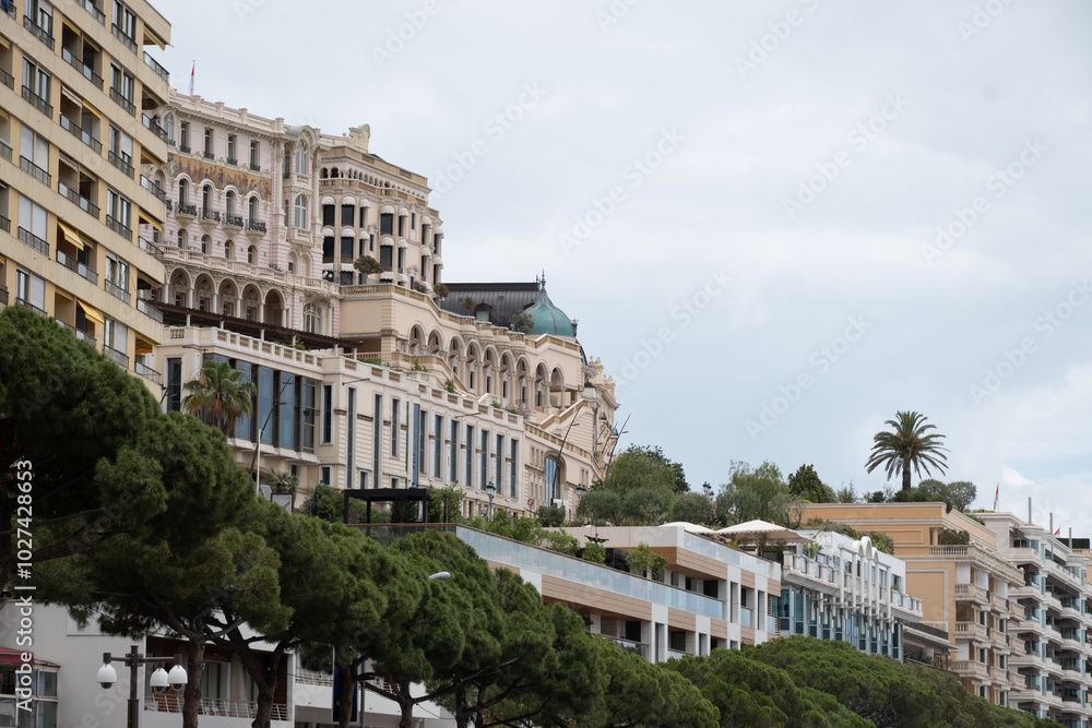 Fototapeta premium Walking in Monte-Carlo city in Monaco principality, houses and streets, touristic destination on Mediterranean Sea in summer