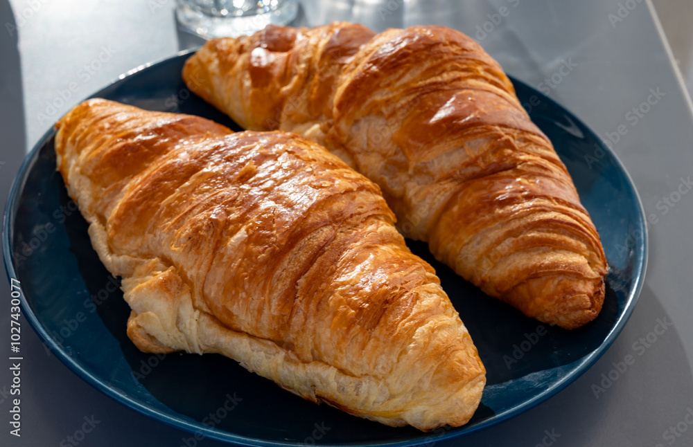 Fresh baked buttered croissants served in restaurant for continental or French breakfast close up Fresh baked buttered croissants served in restaurant for continental or French breakfast close up