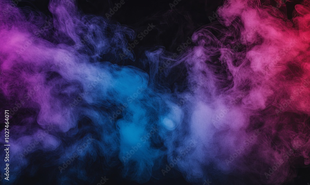Fototapeta premium Abstract smoke in pink and blue colors on a black background.