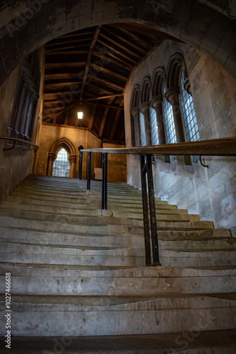  gothic building stairwell windows dim lighting handrail