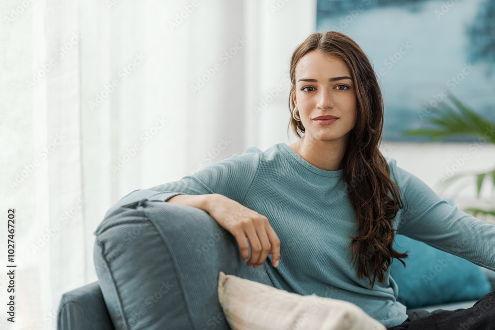 Beautiful young woman posing in the living room Beautiful young woman posing in the living room