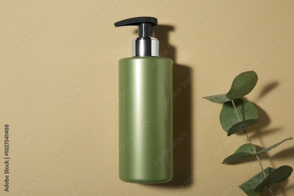 Bottle of shampoo and eucalyptus branch on beige background, flat lay Bottle of shampoo and eucalyptus branch on beige background, flat lay