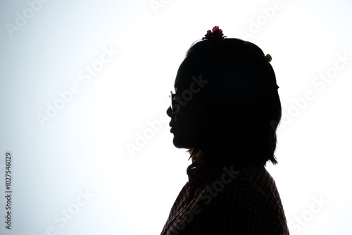 Close up side view silhouette portrait of a girl on white background