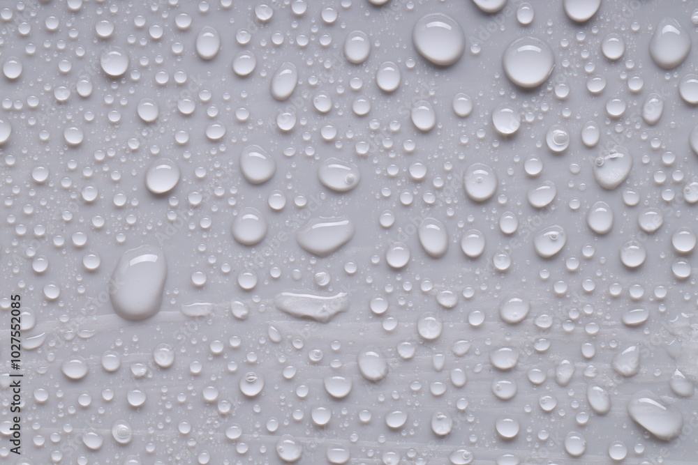 Water drops on gray background, top view Water drops on gray background, top view