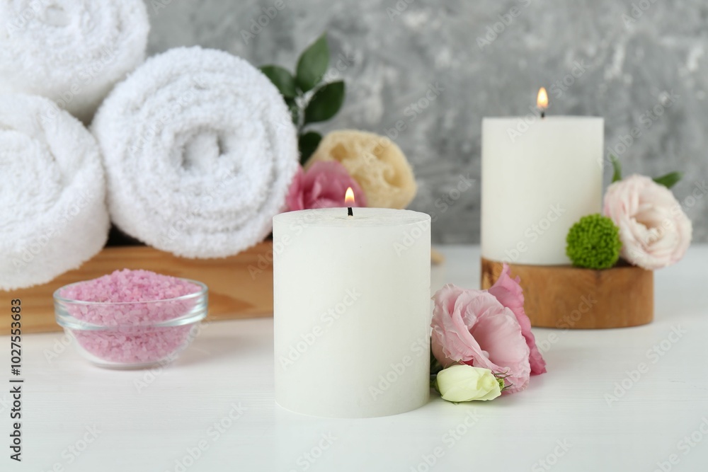 Composition with different spa supplies on white table Composition with different spa supplies on white table