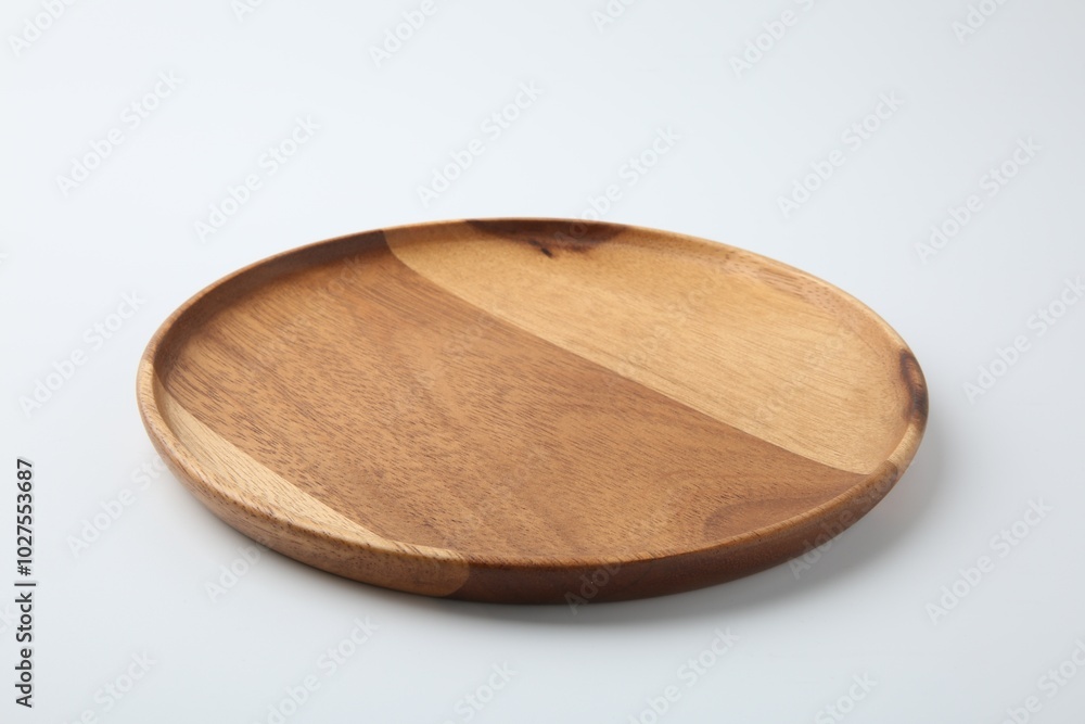 One wooden plate on white background. Tableware One wooden plate on white background. Tableware