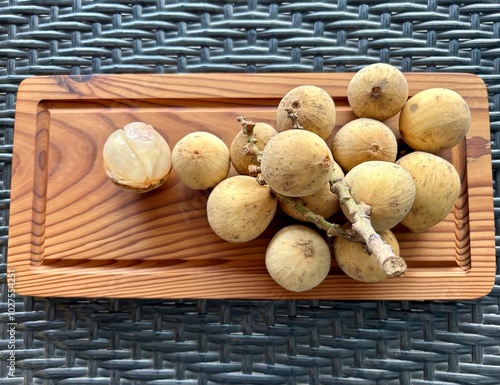 Lanzones fruit or commonly known as dokong, duku or langsat in southeast asia. Sweet fruit with translucent flesh. Lansium Domesticum. photo