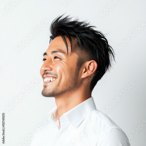 Confident Asian Businessman Smiling and Looking Up