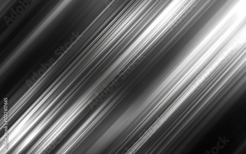 Abstract image featuring diagonal light streaks in black and white, evoking motion and depth.