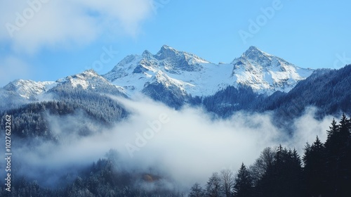 Snow-capped peaks shrouded in winter mist