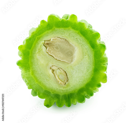 slices of bitter gourd arranged on white background