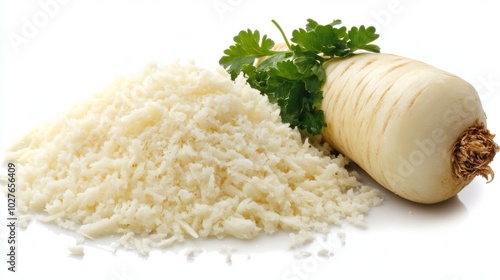 A close-up of freshly grated horseradish with a whole root nearby, isolated on a white background