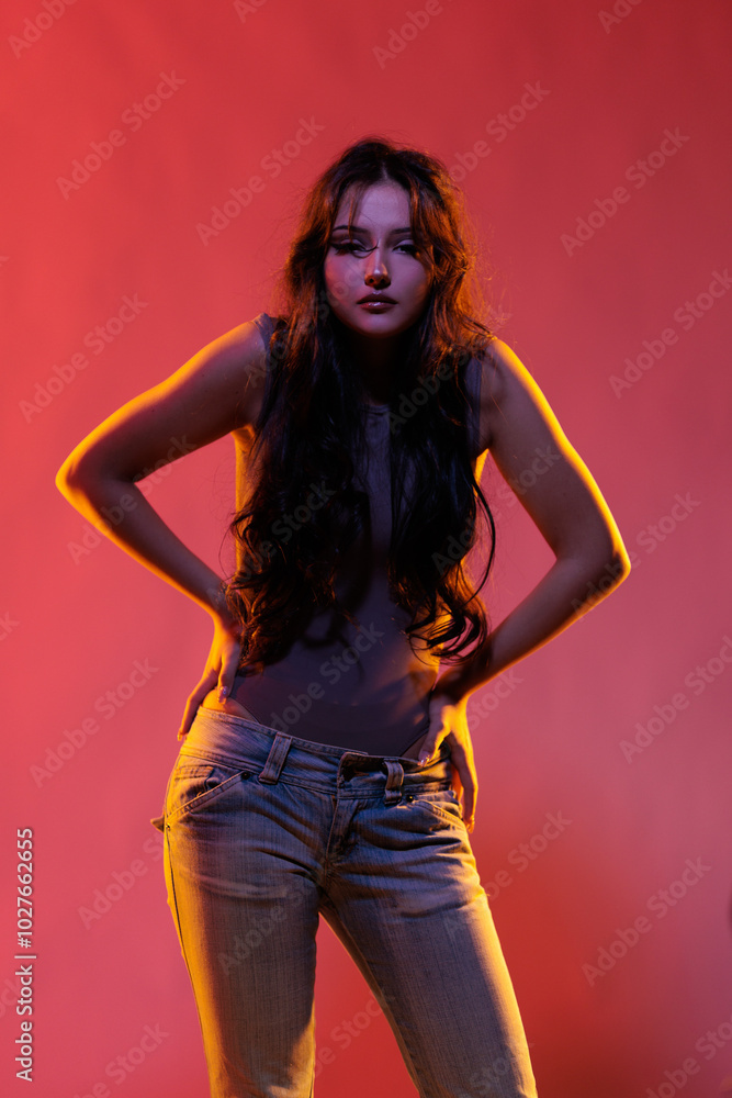 Young girl in red light, play of light and shadow Young girl in red light, play of light and shadow