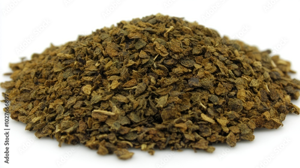 A small heap of dried chamomile flowers with their delicate, daisy-like appearance, laid out on a white background A small heap of dried chamomile flowers with their delicate, daisy-like appearance, laid out on a white background