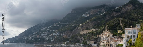 Panoramic view of the town of Amalfi located at the foot of steep cliffs on the southwest coast of Italy photo