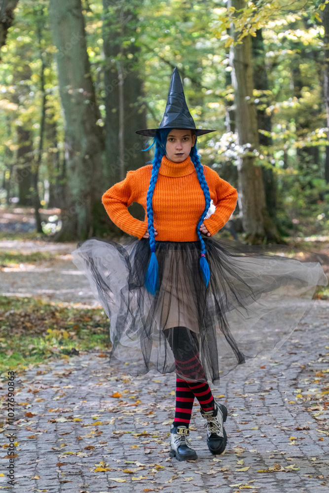 halloween, day of the dead holiday, dressed up witch, funny witch, halloween in autumn forest, orange sweater, witch in striped stockings, teenager halloween, day of the dead holiday, dressed up witch, funny witch, halloween in autumn forest, orange sweater, witch in striped stockings, teenager