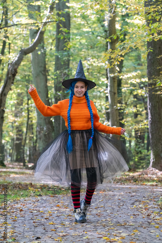 halloween, day of the dead holiday, dressed up witch, funny witch, halloween in autumn forest, orange sweater, witch in striped stockings, teenager halloween, day of the dead holiday, dressed up witch, funny witch, halloween in autumn forest, orange sweater, witch in striped stockings, teenager
