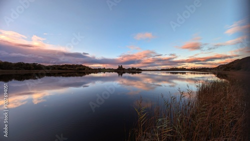 Obraz na płótnie Beautiful orange sunset lakeside landscape scenery at Ross lake, Roscahill, Galway, Ireland, nature background w salonie