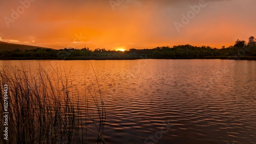 Obraz na płótnie Beautiful orange sunset lakeside landscape scenery at Ross lake, Roscahill, Galway, Ireland, nature background w salonie