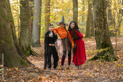 halloween in autumn forest, orange sweater, witch in striped stockings, teenager, boy dracula, red, funny witch, halloween, day of the dead holiday, dressed up witch