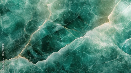 A marble texture with veins in an emerald green color. An abstract background with a natural stone design.
