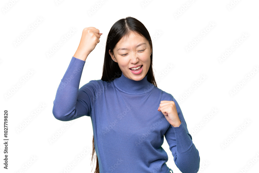 Young Asian woman over isolated chroma key background celebrating a victory Young Asian woman over isolated chroma key background celebrating a victory