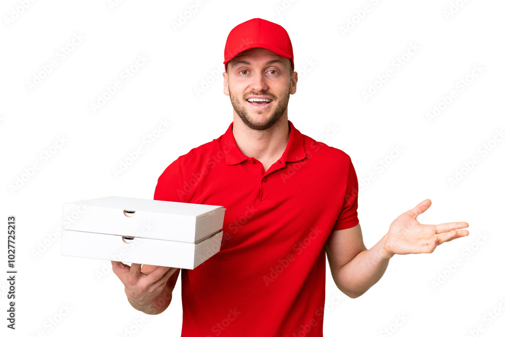Pizza delivery man with work uniform picking up pizza boxes over isolated chroma key background with shocked facial expression Pizza delivery man with work uniform picking up pizza boxes over isolated chroma key background with shocked facial expression