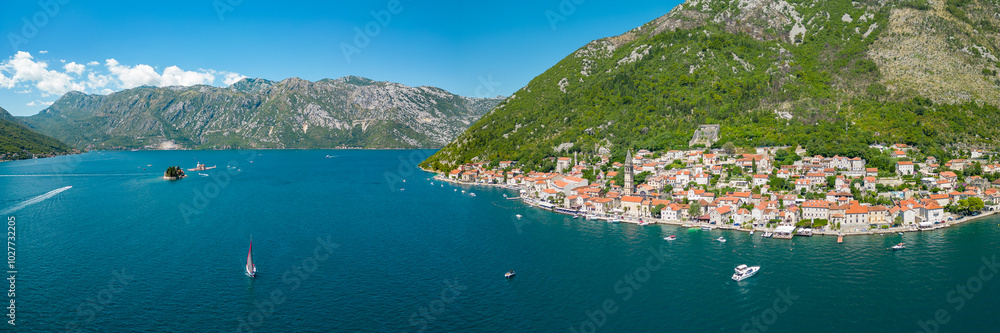 Naklejka premium Aerial drone view of Perast city. Situated in Montenegro is a famous travel destination. View of Church of San Nicholas. Panoramic top view of costal city.