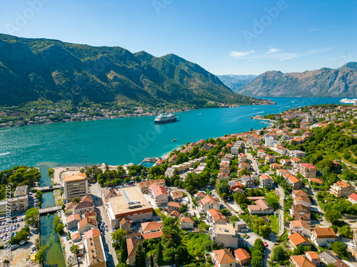 Aerial view of famous travel destination Kotor. Situated in Montenegro. Panoramic view of all region. Luxury cruise ships and yachts. Turquoise water. 