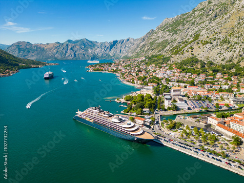 Aerial view of famous travel destination Kotor. Situated in Montenegro. Panoramic view of all region. Luxury cruise ships and yachts. Turquoise water. 