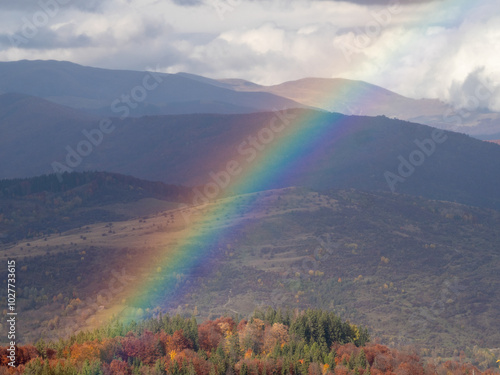 Rainbow seen from the Secaria peak, Prahova County, Romania photo