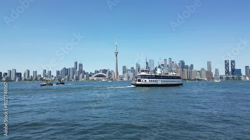 Wallpaper Mural Ferry sailing toward downtown Toronto waterfront skyline view from Centre Island showing the city shoreline including the famous CN tower Torontodigital.ca