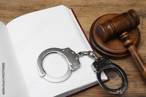 Canvas Print Book, judge's gavel and handcuffs on wooden table