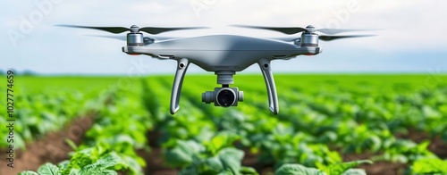 Drone flying over a lush green field, capturing aerial agricultural insights. photo