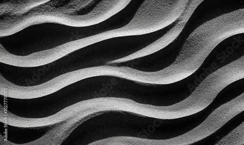 An artistic monochromatic depiction of wavy sand, focusing on smooth curves and textures, conjuring feelings of tranquility and balance in modern art forms. photo