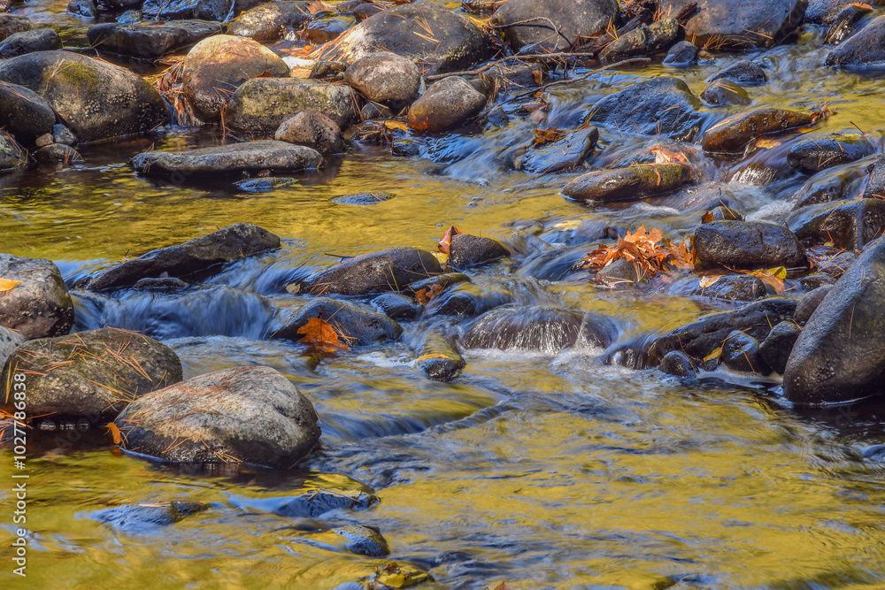 water flowing over rocks in the quinapoxet river water flowing over rocks in the quinapoxet river