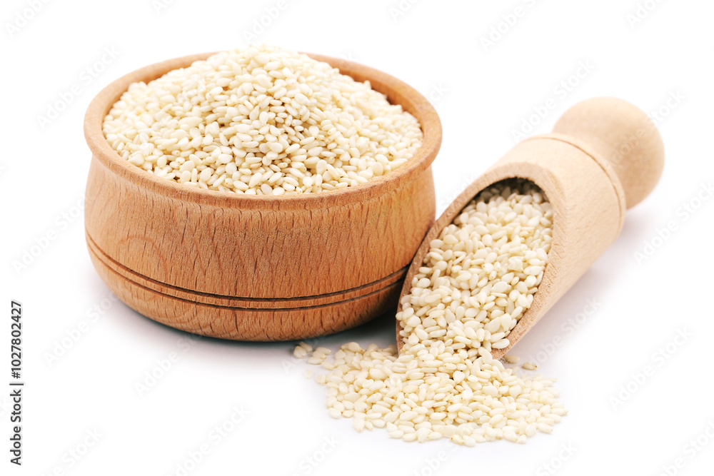 Sesame seeds in wooden scoop and bowl isolated on white background
