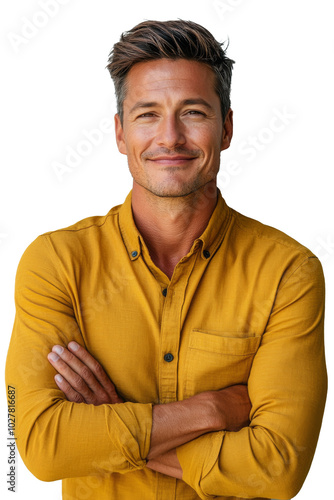 A smiling man with a confident stance showcasing casual style in a minimalist...