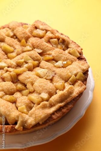 Wallpaper Mural Tasty homemade apple pie on yellow background, closeup Torontodigital.ca
