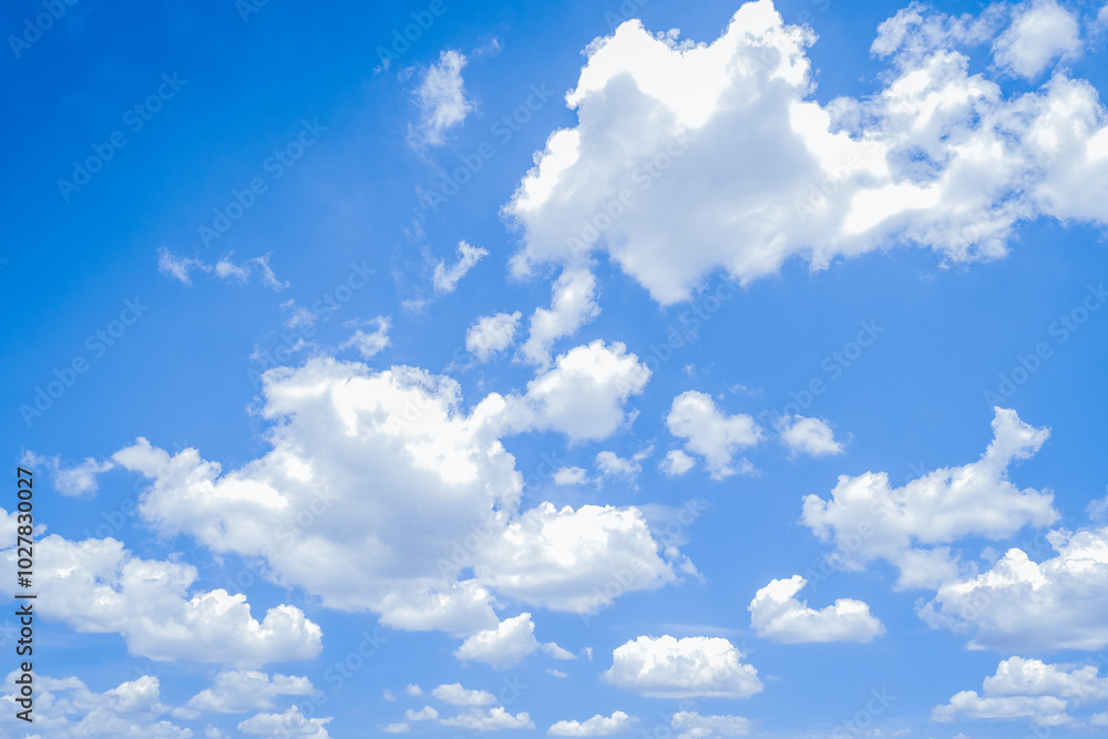 Bright Blue Sky with Fluffy White Clouds - Perfect Natural Background Bright Blue Sky with Fluffy White Clouds - Perfect Natural Background